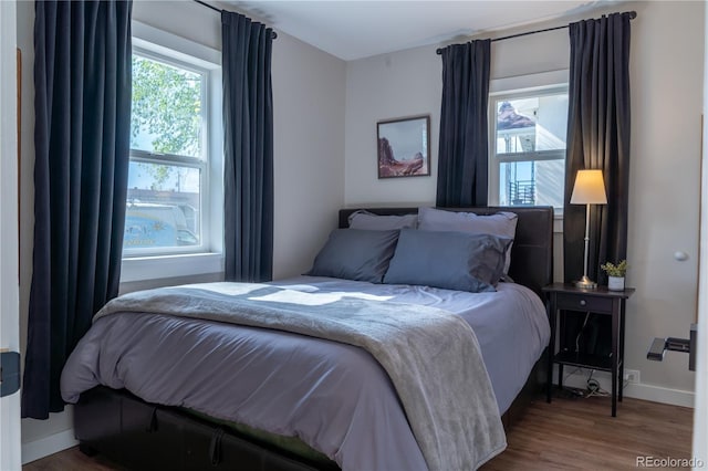 134 S Quitman St, Denver, CO 80219 - bedroom with wood finished floors and baseboards