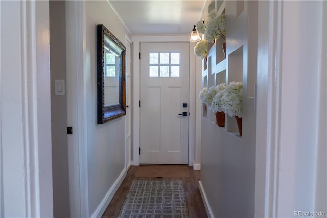134 S Quitman St, Denver, CO 80219 - entryway with baseboards, dark wood-style flooring, and ornamental molding
