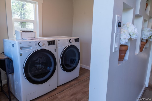 134 S Quitman St, Denver, CO 80219 - washroom with washing machine and dryer, wood finished floors, and baseboards