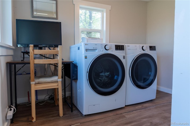 134 S Quitman St, Denver, CO 80219 - clothes washing area featuring washer and dryer, wood finished floors, and baseboards