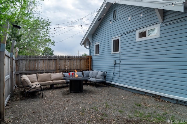 134 S Quitman St, Denver, CO 80219 - view of patio featuring an outdoor living space with a fire pit and a fenced backyard