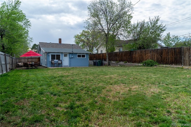 134 S Quitman St, Denver, CO 80219 - view of yard featuring a patio