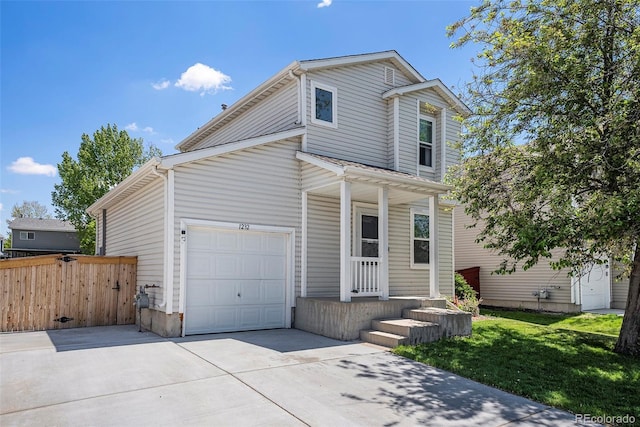1232 Bluebird St, Brighton, CO 80601 - traditional home with concrete driveway, an attached garage, and covered porch