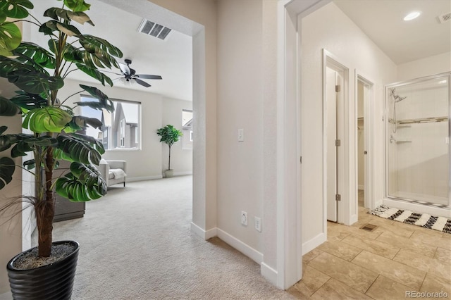 corridor with light colored carpet