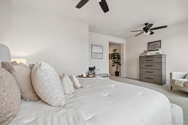 bedroom featuring light colored carpet and ceiling fan