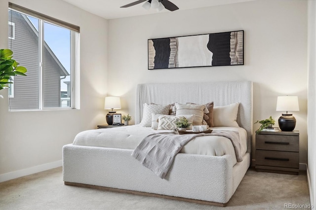 bedroom with light carpet and ceiling fan