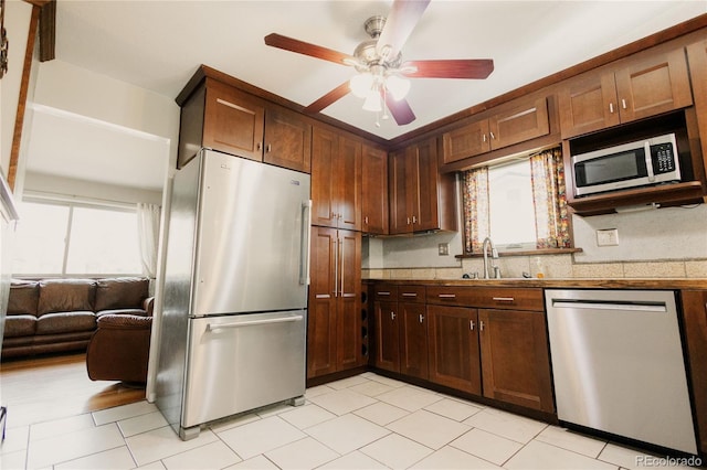 2535 W Bijou St, Colorado Springs, CO 80904 - kitchen featuring a sink, a ceiling fan, light tile patterned floors, and appliances with stainless steel finishes