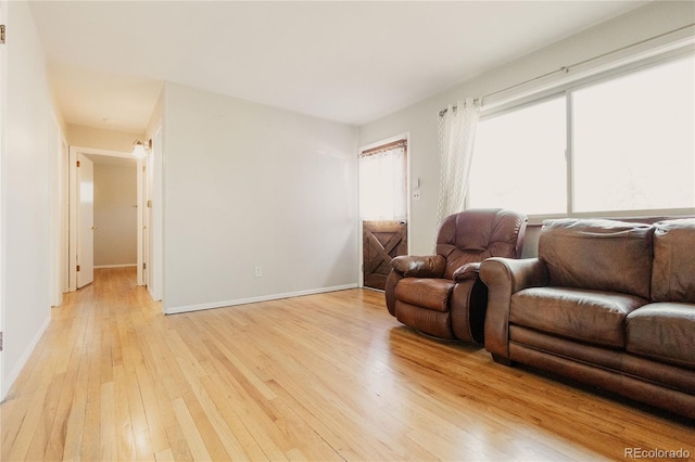 2535 W Bijou St, Colorado Springs, CO 80904 - living area with light wood-style flooring and baseboards