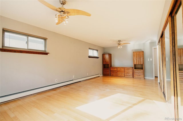 2535 W Bijou St, Colorado Springs, CO 80904 - empty room featuring baseboards, a ceiling fan, baseboard heating, and wood finished floors