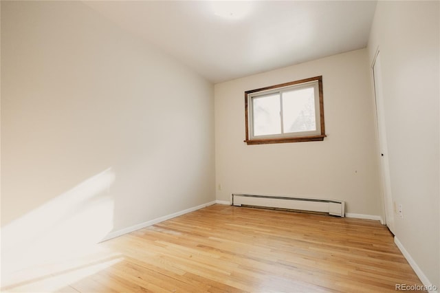 2535 W Bijou St, Colorado Springs, CO 80904 - unfurnished room with lofted ceiling, light wood-style flooring, baseboards, and baseboard heating