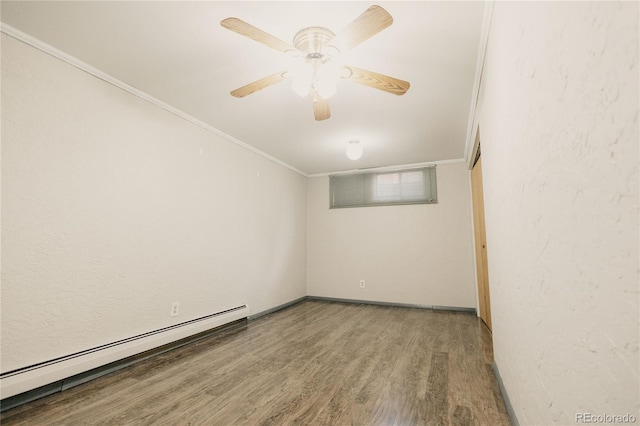 2535 W Bijou St, Colorado Springs, CO 80904 - empty room with crown molding, ceiling fan, baseboard heating, and wood finished floors