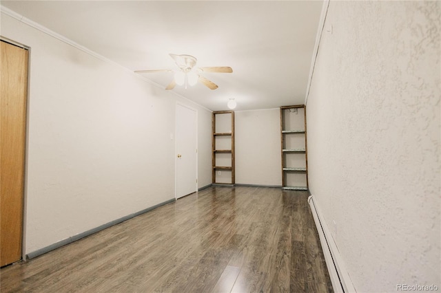 2535 W Bijou St, Colorado Springs, CO 80904 - spare room featuring ceiling fan, crown molding, baseboard heating, and wood finished floors