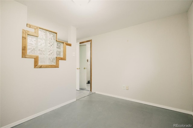 2535 W Bijou St, Colorado Springs, CO 80904 - unfurnished room featuring baseboards and finished concrete flooring