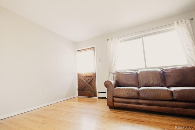 2535 W Bijou St, Colorado Springs, CO 80904 - living room with baseboards, wood finished floors, and a baseboard radiator