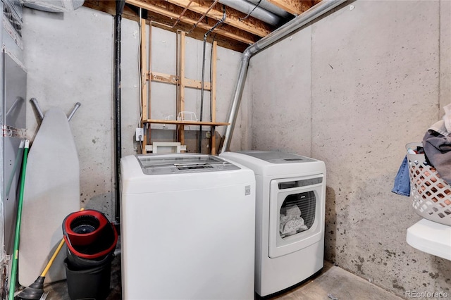 laundry area with laundry area and washer and clothes dryer