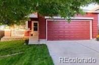 exterior space featuring fence and a lawn