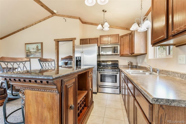 631 County Road 61, Cripple Creek, CO 80813 - kitchen with stainless steel appliances, a sink, a chandelier, vaulted ceiling, and pendant lighting