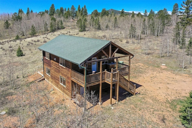 631 County Road 61, Cripple Creek, CO 80813 - rear view of house with a deck and stairway