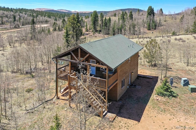 631 County Road 61, Cripple Creek, CO 80813 - view from above of property featuring mountains and a heavily wooded area