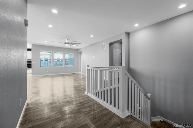 6932 E 133rd Ave, Thornton, CO 80602 - hallway featuring an upstairs landing, wood finished floors, and recessed lighting