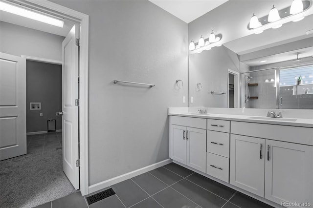 6932 E 133rd Ave, Thornton, CO 80602 - bathroom featuring double vanity, a shower stall, and tile patterned flooring