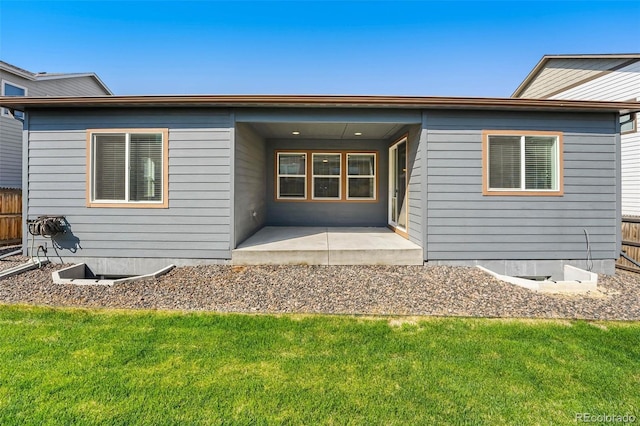 6932 E 133rd Ave, Thornton, CO 80602 - rear view of property with a lawn