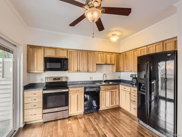 13645 E Yale Ave Unit C, Aurora, CO 80014 - kitchen featuring black appliances, dark countertops, light brown cabinetry, crown molding, and a sink