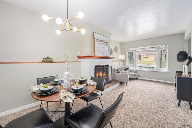 6513 Gray St, Arvada, CO 80003 - carpeted dining area with a fireplace and a chandelier
