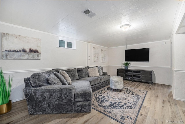 6513 Gray St, Arvada, CO 80003 - living area featuring wood finished floors and ornamental molding