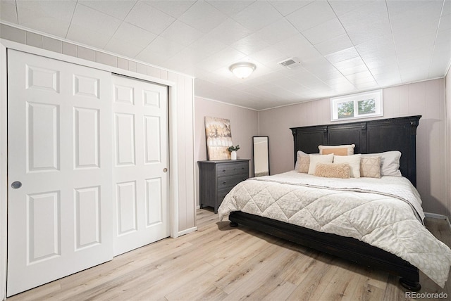 6513 Gray St, Arvada, CO 80003 - bedroom featuring light wood finished floors and a closet