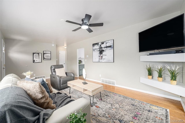 6513 Gray St, Arvada, CO 80003 - living area featuring ceiling fan and wood finished floors