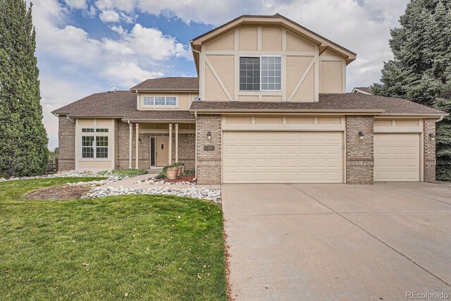 9357 Lark Sparrow Dr, Highlands Ranch, CO 80126 - view of front of property with concrete driveway, a shingled roof, an attached garage, a front yard, and brick siding