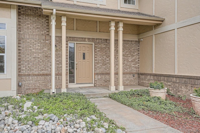 entrance to property featuring a porch