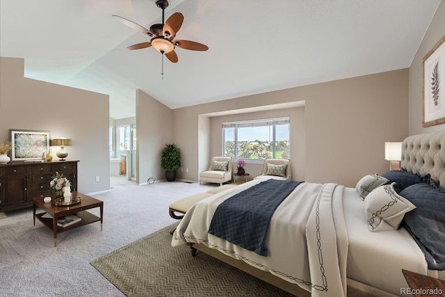 bedroom with connected bathroom, ceiling fan, lofted ceiling, and light colored carpet