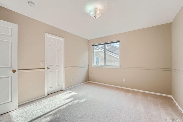 9357 Lark Sparrow Dr, Highlands Ranch, CO 80126 - unfurnished bedroom featuring baseboards and carpet floors