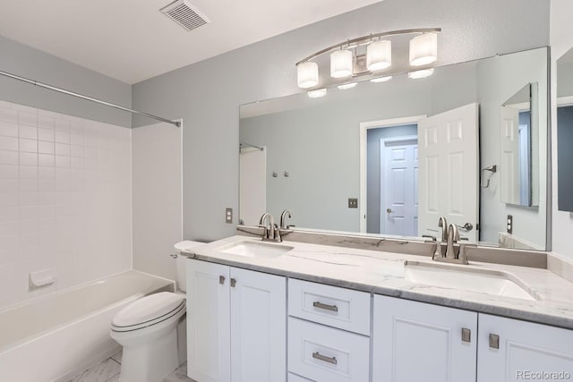 full bathroom featuring vanity, toilet, and shower / bath combination