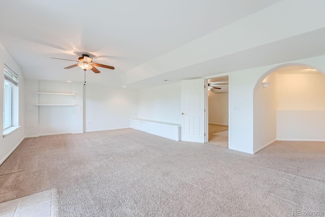 carpeted empty room with ceiling fan