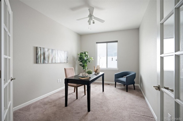 office with french doors, light carpet, ceiling fan, and baseboards