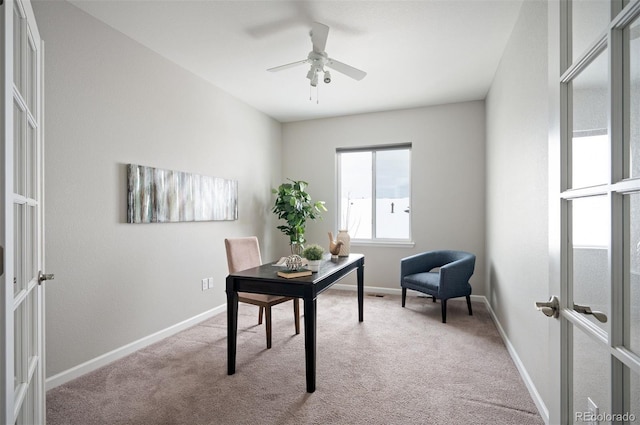 carpeted office featuring ceiling fan, baseboards, and french doors
