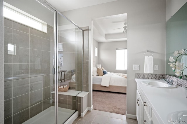 full bath featuring ensuite bath, tile patterned floors, double vanity, a ceiling fan, and a stall shower