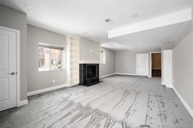unfurnished living room with baseboards and carpet floors