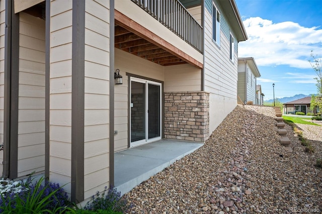 10786 Bear Cub Dr, Broomfield, CO 80021 - view of home's exterior with a balcony and stone siding