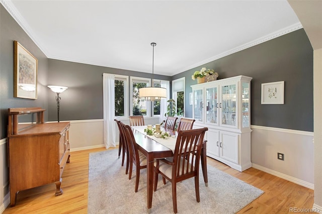 85 Willowleaf Dr, Littleton, CO 80127 - dining area featuring light wood-type flooring, crown molding, and baseboards