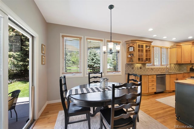 85 Willowleaf Dr, Littleton, CO 80127 - dining area featuring light wood-style floors, a chandelier, baseboards, and recessed lighting