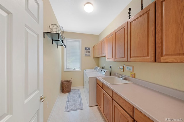 85 Willowleaf Dr, Littleton, CO 80127 - washroom featuring cabinet space, washing machine and clothes dryer, and baseboards