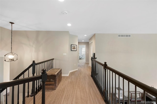 85 Willowleaf Dr, Littleton, CO 80127 - corridor featuring an upstairs landing, baseboards, a chandelier, recessed lighting, and light carpet