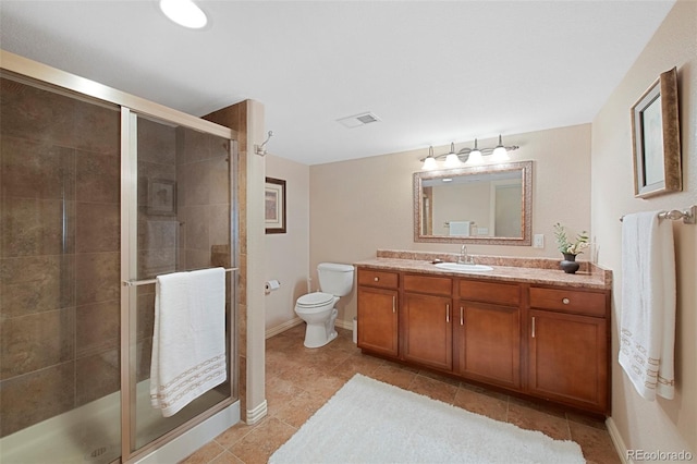 85 Willowleaf Dr, Littleton, CO 80127 - full bathroom with vanity, toilet, a stall shower, and tile patterned floors