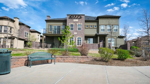 924 Brookhurst Ave Unit C, Highlands Ranch, CO 80129 - exterior space with a residential view, a chimney, and stucco siding