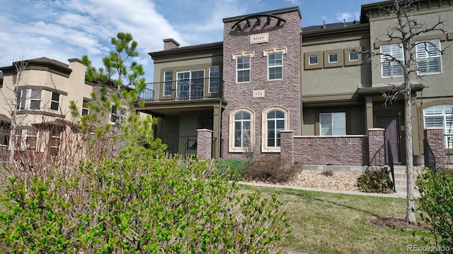 924 Brookhurst Ave Unit C, Highlands Ranch, CO 80129 - view of property featuring stucco siding and a balcony