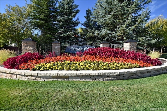 community sign featuring a lawn